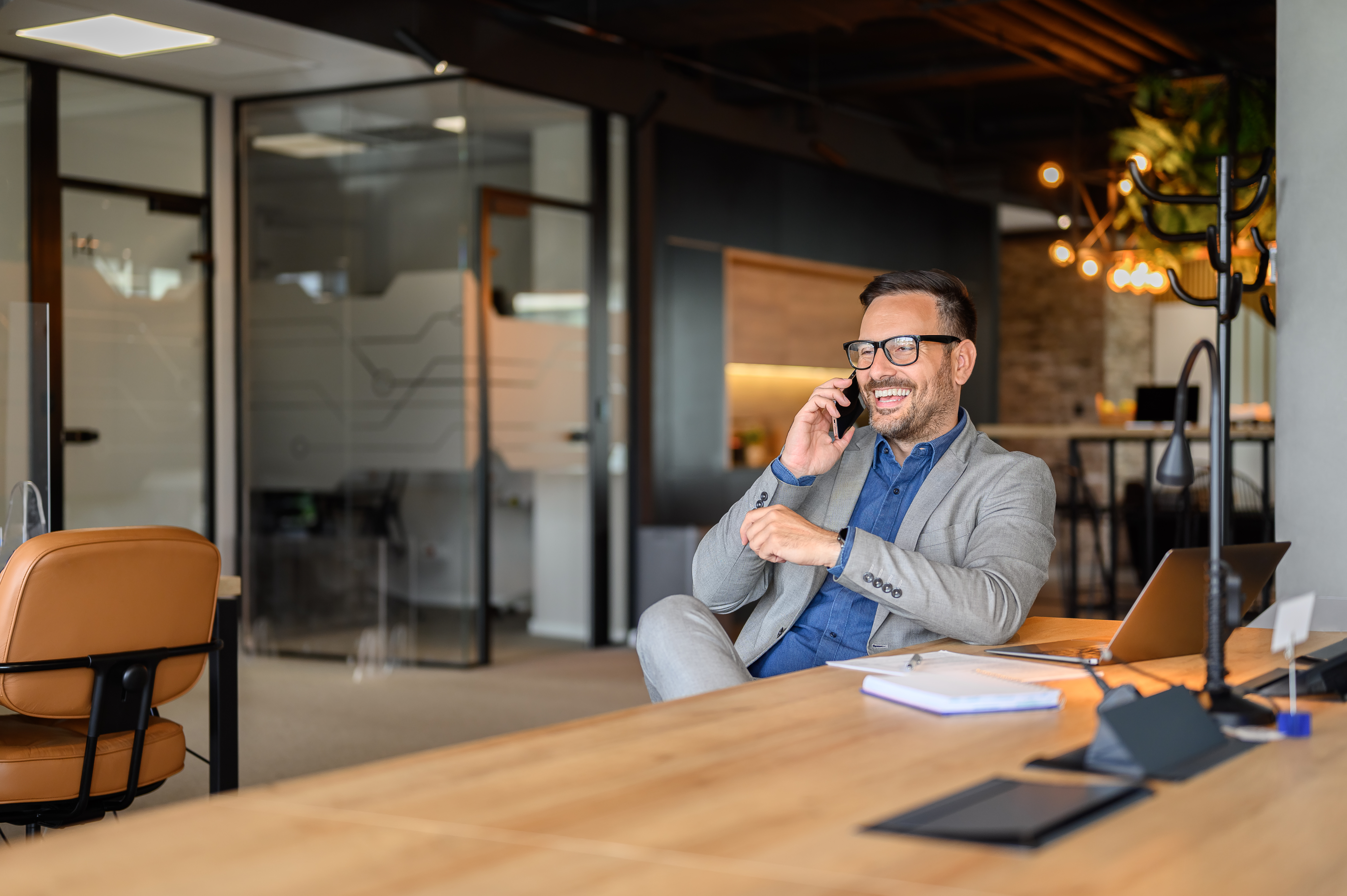 Men talking on the phone at the office